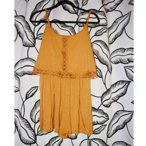 yellow spaghetti strap romper with embroidery